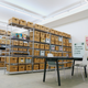 Shelves filled with cardboard boxes of items from the archives of the Museum of Chinese in America in its new research center space in New York City.
